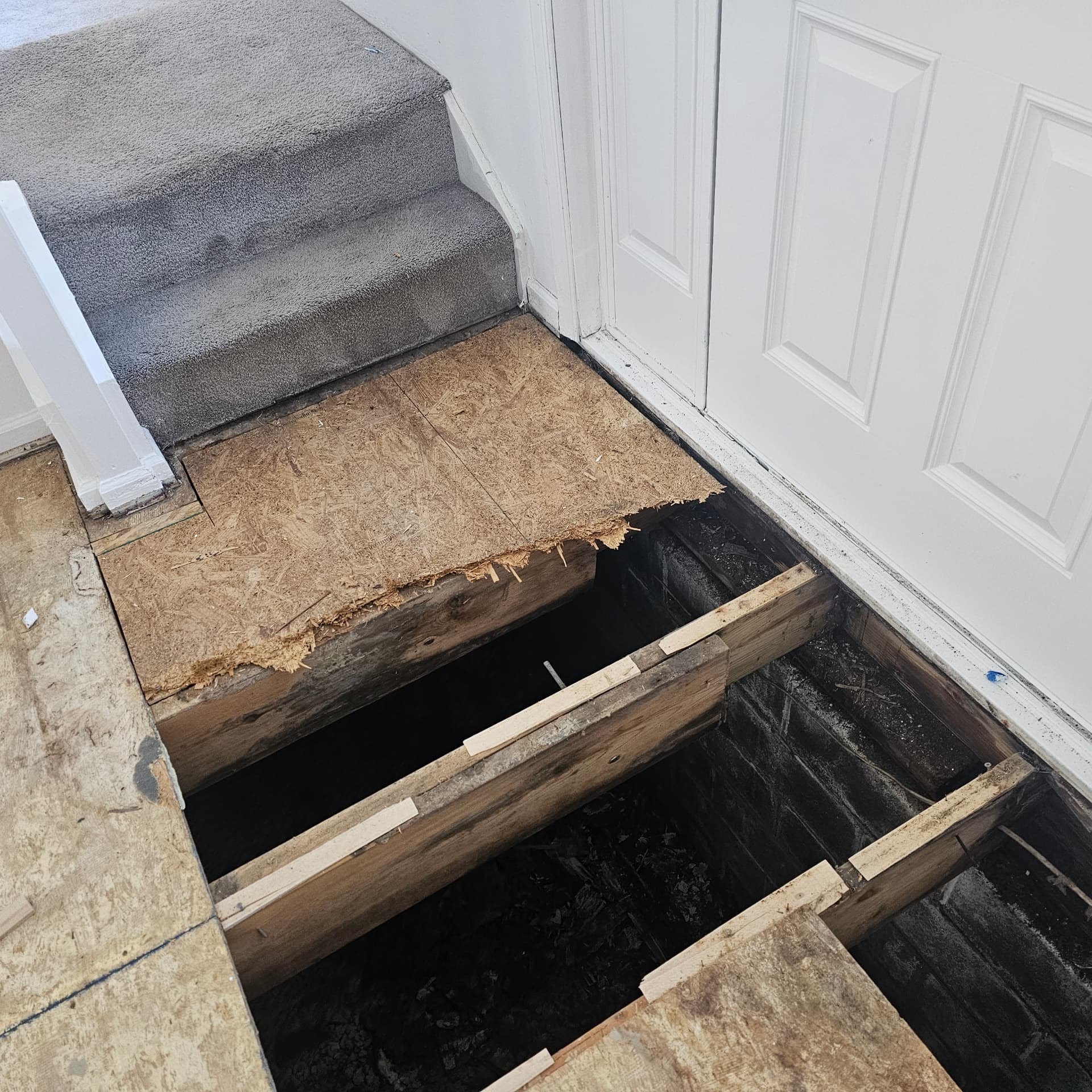 Rotted subfloor opened up at the entry